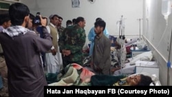 Passengers who were injured in the April 23 collision receive treatment at a hospital in Zabul Province.