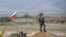NAGORNO-KARABAKH -- A Russian peacekeeper patrols at a checkpoint outside Askeran, November 20, 2020