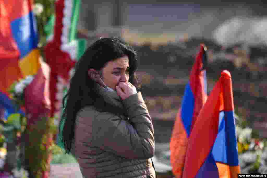A woman cries at the Yerablur cemetery on December 19.&nbsp;