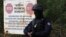 With rising tensions, a Kosovo police officer stands guard at the border crossing of Jarinje on September 20.