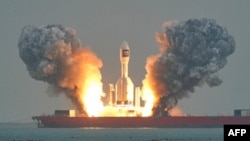 A Chinese Gravity-1 rocket lifts off on October 11 carrying three satellites into orbit