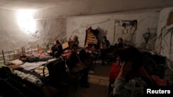 NAGORNO-KARABAKH -- Civilians gather in the basement of an art art school used as a bomb shelter in the town of Martuni, October 14, 2020