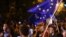 Armenia - Paruyr Hayrikian (L) and his supporters carry European Union flags on Marshal Bagramian Avenue, Yerevan, 2Jul2015.