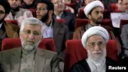 آیت‌الله احمد جنتی، دبیر شورای نگهبان همراه با سعید جلیلی، نماینده رهبر در شورای عالی امنیت ملی.