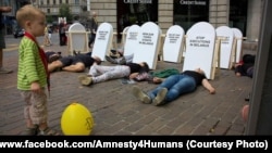 A protest in Zurich by members of Amnesty International against capital punishment in Belarus in August