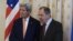 Russia -- Russian Foreign Minister Sergei Lavrov (R) greets US Secretary of State John Kerry during a meeting in Moscow, March 24, 2016