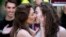 France -- Two women kiss on 23Apr2013 during a pro gay marriage demonstration called by the "oui , oui, oui" (yes, yes, yes) movement outside the French national assembly in Paris.