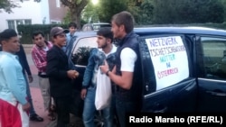 Austria --Chechens from Austria brought food in refugee camp, Vienna, 13 September 2015
