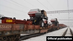 Armenia - A freight train loaded with agricultural equipment at a railway station in Yerevan, 1Mar2017