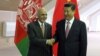 Afghan President Ashraf Ghani (left) meets with Chinese President Xi Jinping.