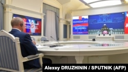 Russian President Vladimir Putin attends by a video conference a trilateral meeting with the leaders of Iran and Turkey on the topic of Syria, in Moscow on July 1, 2020.