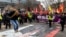 Protesters demonstrate against Turkish President Recep Tayyip Erdogan and Sweden's NATO bid in a rally arranged by the Kurdish Democratic Society Center in Stockholm on January 21. 
