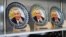 Souvenir plates featuring a portrait of former President Islam Karimov on sale in Samarkand (file photo)