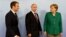 Эммануэль Макрон, Владимир Путин и Ангела Меркель перед началом переговоров в Гамбурге, лето 2017 года