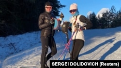 Darya Dalidovich (left) and Svyatlana Andryyuk pose for a photo in December.