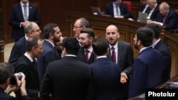 Armenia - Deputies from the ruling Civil Contract party talk on the parliament floor, Yerevan, April 15, 2025.