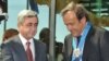 Armenia -- President Serzh Sarkisian gives a Medal of Honor to UEFA President Michel Platini, 1Sept 2010.