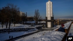 A woman walks near the National Museum of the Holodomor-Genocide in Kyiv. (file photo)
