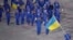 SOUTH KOREA -- Olena Pidhrushna of Ukraine carries the national flag during the Olympic Opening ceremony reception in Pyeongchang, February 9, 2018