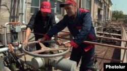Armenia -- Workers at a natural gas distribution facility.