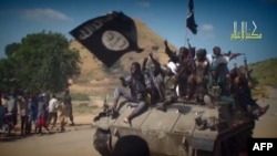 تصویری گرفته شده از یک ویدئو که اعضای گروه بوکو حرام را نشان می‌دهد