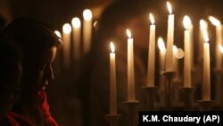 Pakistani Christian children sing at St. Patrick's Church ahead of Christmas celebrations in Karachi, Pakistan, in December 2018.