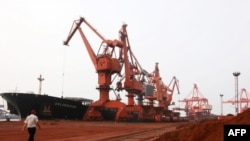 Soil containing various rare-earth elements waits to be loaded on to a ship at a port in Lianyungang, China. (File photo)