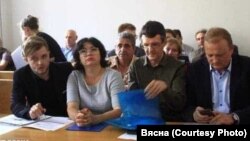 Aksana Kolb (second left), editor-in-chief of the newspaper Novy Chas, has been recognized as a political prisoner by local rights groups since her arrest in April.