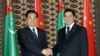 Turkmen President Gurbanguly Berdymukhammedov (right) meets with his Chinese counterpart, Hu Jintao, in Ashgabat on December 13.