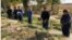 Local officials and farmers in the Tashkent region were forced to stand in a water-filled ditch.