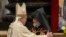 Vatican -- Aram I (R), head of the Catholicosate of the Great House of Cilicia, speaks with Pope Francis during an Armenian-Rite Mass marking 100 years since the Armenian genocide, at St Peter's basilica in Vatican, April