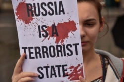 "Россия – террористическое государство". Акция протеста во Львове после гибели украинских военнопленных в Еленовке