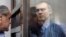 Dmitry Dovgy in a Moscow courtroom in 2009
