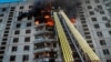 Firefighters work at the site of a Russian air strike in Kharkiv on September 15.