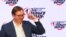 Serbian President Aleksandar Vucic gestures at Serbian Progressive Party (SNS) headquarters after his election victory.