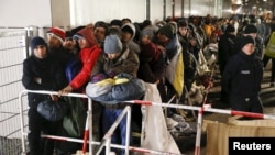 Migrants line up to register at the Berlin Office of Health and Social Affairs in Berlin in 2015. Germany received more than 1 million refugees in 2015 and 2016, the majority of whom were fleeing Syria and Afghanistan.