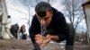 A migrant washes his face at the Vucjak refugee camp on December 6.