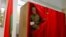 A soldier leaves a voting booth in Minsk to cast his ballot during early voting for Belarus's parliamentary elections.