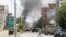 Smoke rises from an area where explosions and gunshots were heard in Jalalabad on July 28.