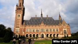 NETHERLANDS -- People walk toward the International Court of Justice in the Hague, August 27, 2018