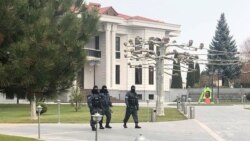 Armenia -- Masked policemen are seen outside Ruben Hayrapetian's house, Yerevan, December 13, 2019.