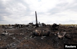 Уламки літака Іл-76 на місці падіння. Луганська область, червень 2014 року