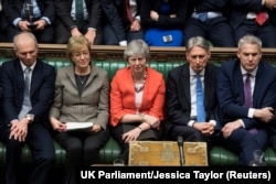 Тереза Мей (у центрі) і члени її уряду. 12 березня, 2019 року