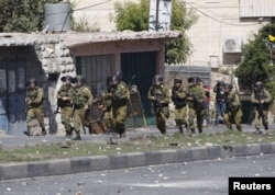 Ізраїльські солдати під час зіткнень з палестинцями в місті Хеврон. 13 жовтня 2015 року