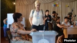 Nagorno-Karabakh - A foreign observer at a polling station in Stepanakert, 19Jul2012.