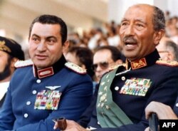 Анвар Содот ва Ҳусни Муборак.