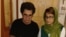Iran -- dissidents Jafar Panahi (left) and Nasrin Sotoudeh sign their letter to South African antiapartheid icon Nelson Mandela, undated