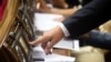 A Ukrainian lawmaker casts a vote during a session of parliament in Kyiv. (file photo)