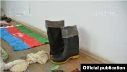 Nagorno-Karabakh - Weapons, ammunition and an Azerbaijani flag which the Karabakh Armenian military says were confiscated from an arrested member of an Azerbaijani "sabotage" group, 10Jul2014.