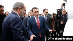 Armenia - Businessman Karen Ghazarian (C) shows Prime Minister Nikol Pashinian around a newly built dairy factory of his Spayka company, Yerevan, March 26, 2019.